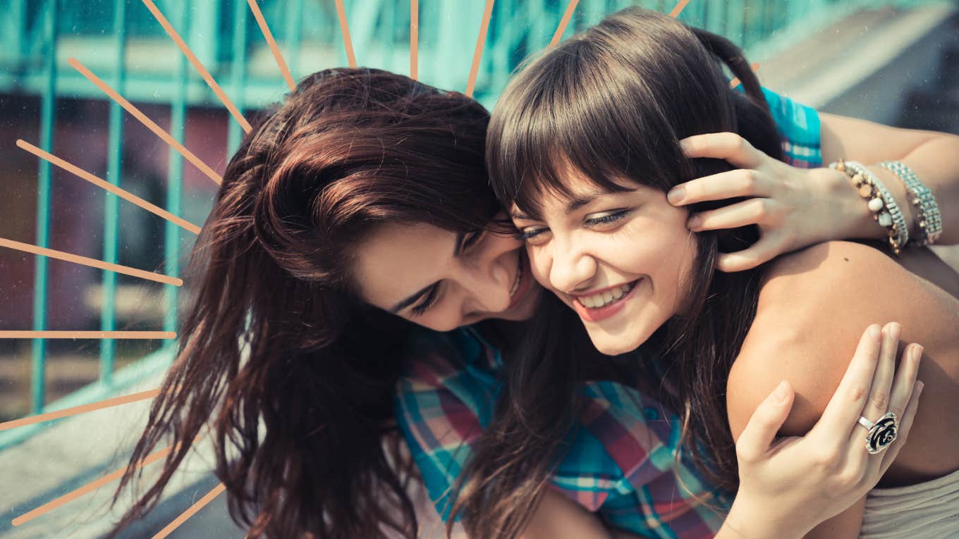 Two sister embracing being playful