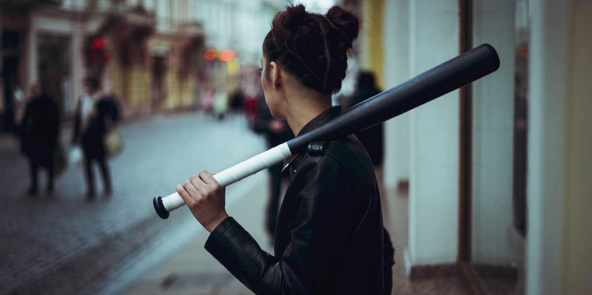 My Toxic Trait Is Negative Self-Talk woman with bat