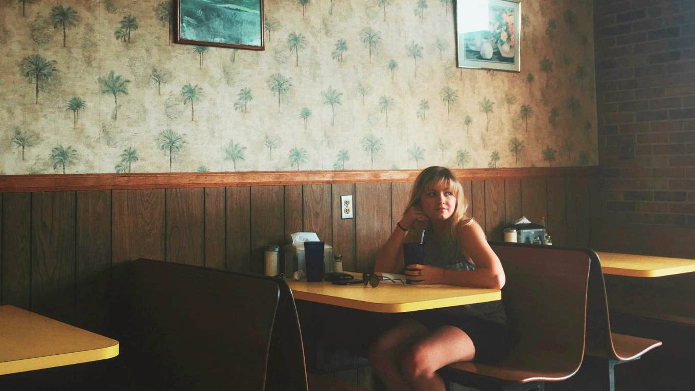My Uncle Trashed My Self-Esteem With One Comment Young girl sitting at diner, upset