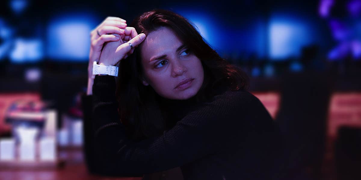 sad woman sitting at diner table