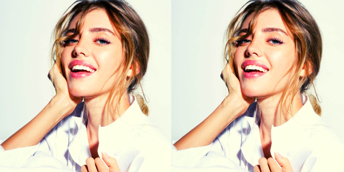 beautiful woman smiling slyly at the camera