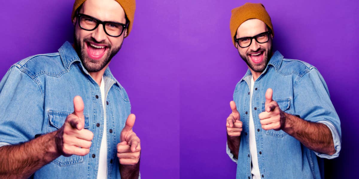 man standing in front of purple background practicing negging