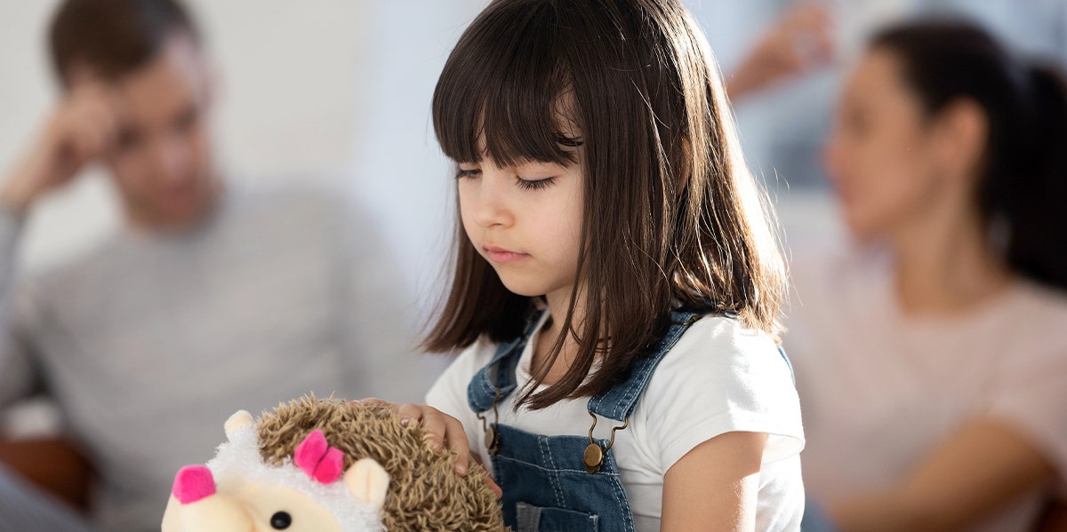 What Is Nesting? The Divorced Parenting Technique That Helps Children Adjust sad girl with divorced parents