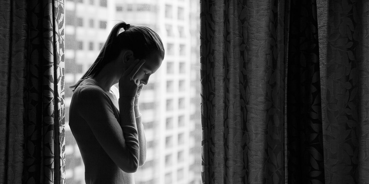 I Never Believed My Ex Cheated On Me — Even Though I Had Evidence woman with head in hands in profile