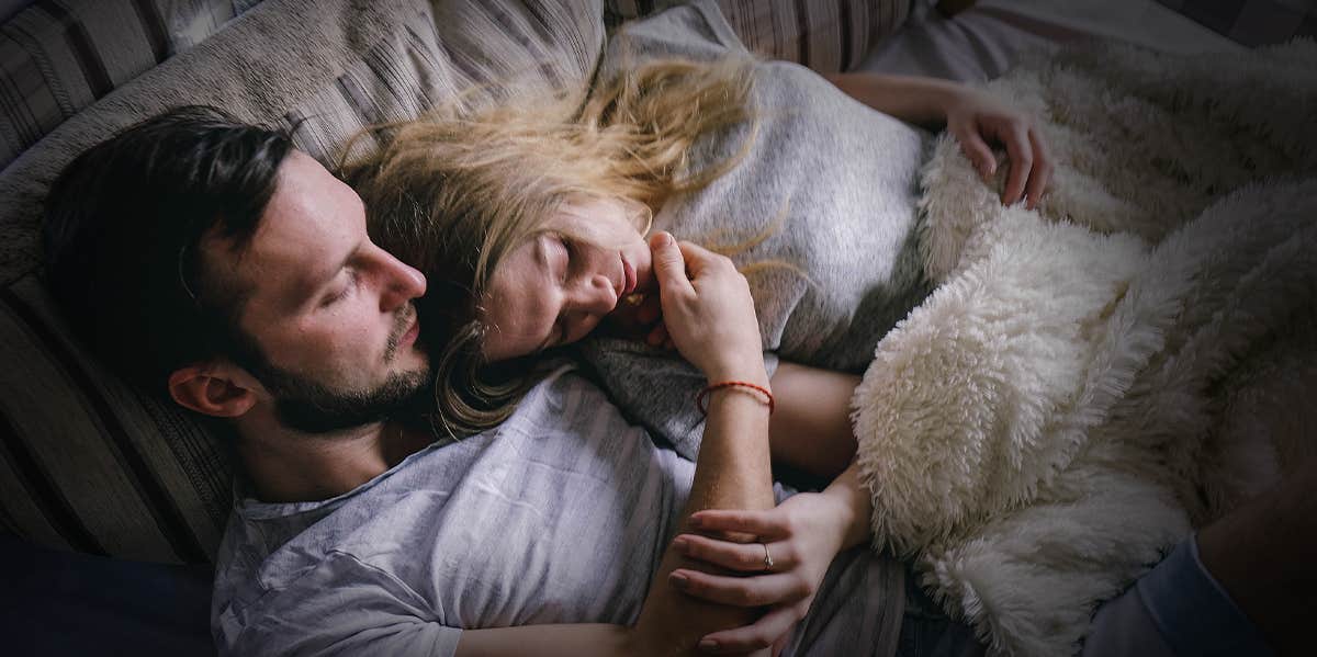 Couple laying in bed