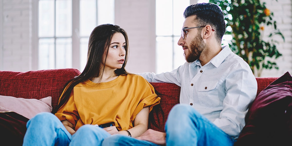 couple arguing on a couch