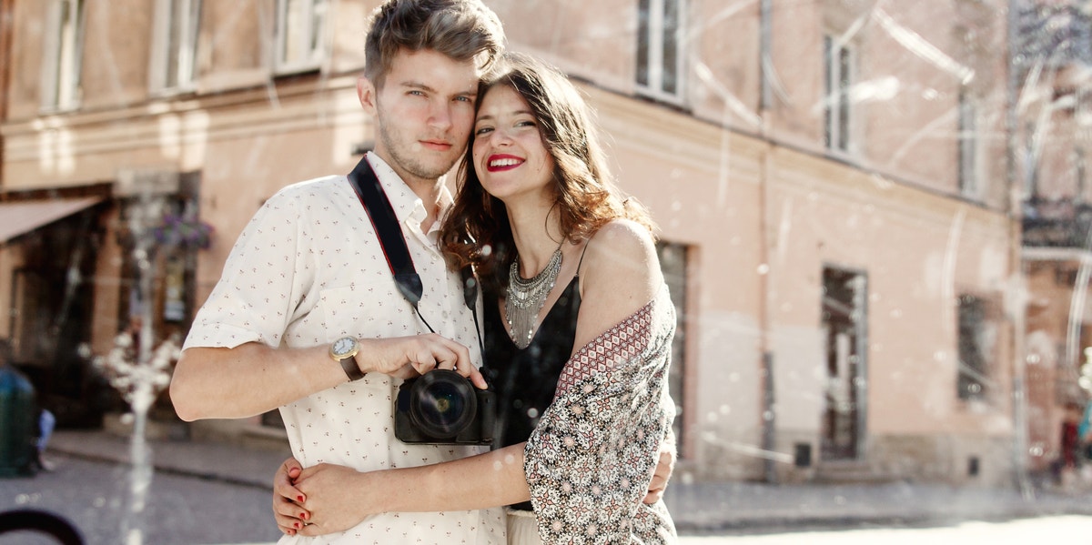 couple taking picture in mirror