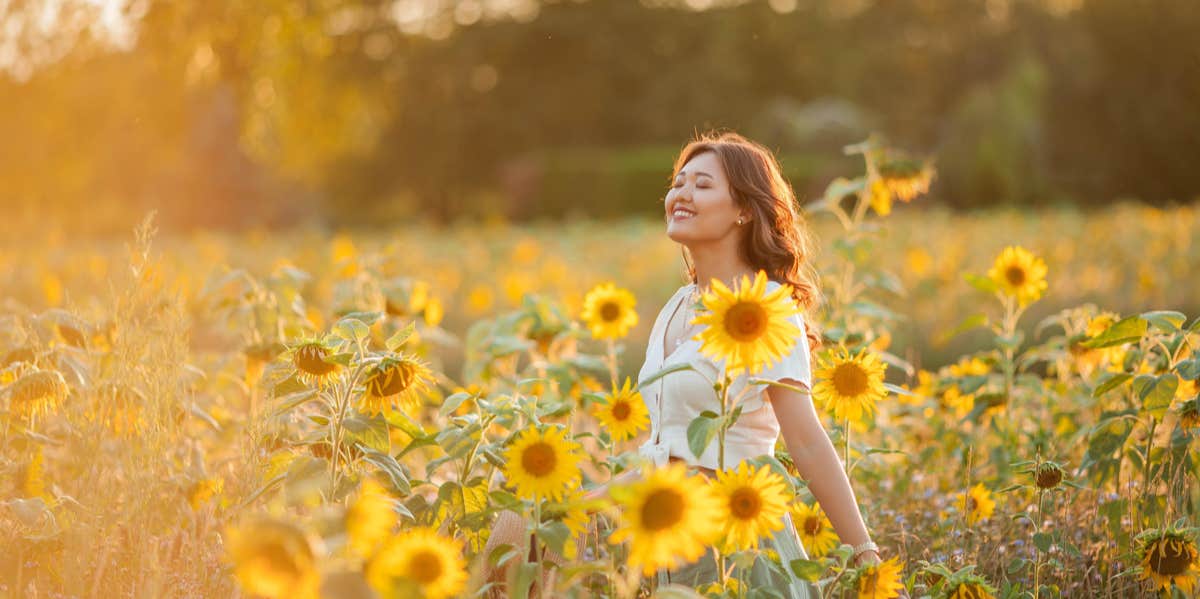 woman in a field of sunflowers
