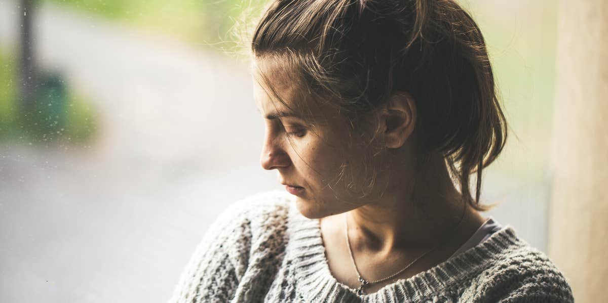 I Met A New Kind of Grief When My Daughter Was Diagnosed With A Rare Disease grieving woman