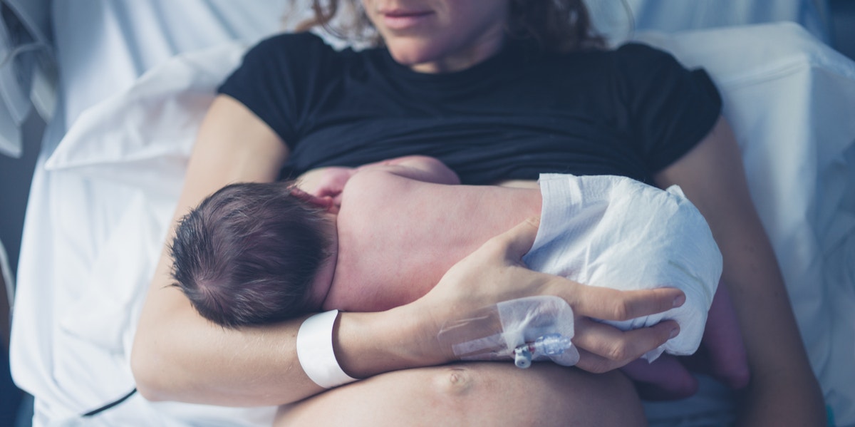 mother holding newborn baby