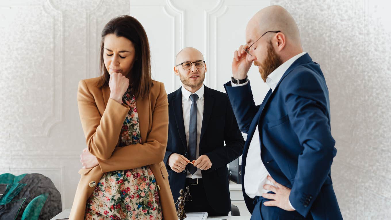 Why Most People Get Divorced In These Two Months, According To Research couple in lawyers office getting a divorce