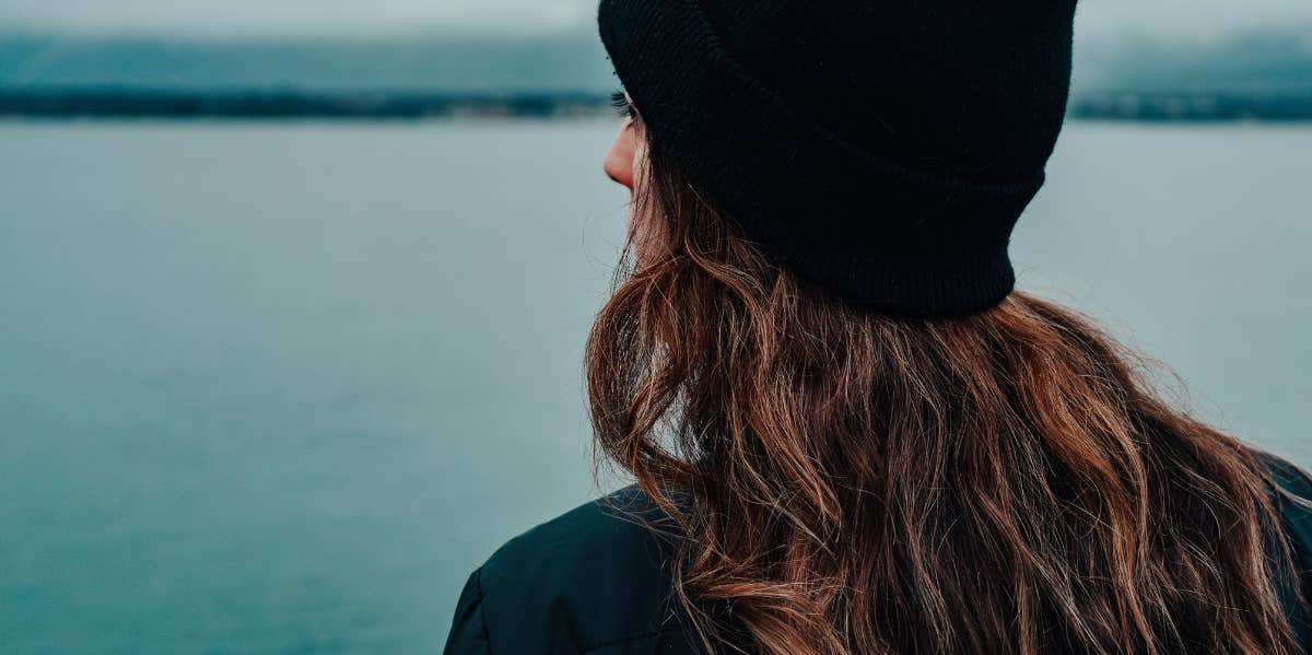 woman looking into water