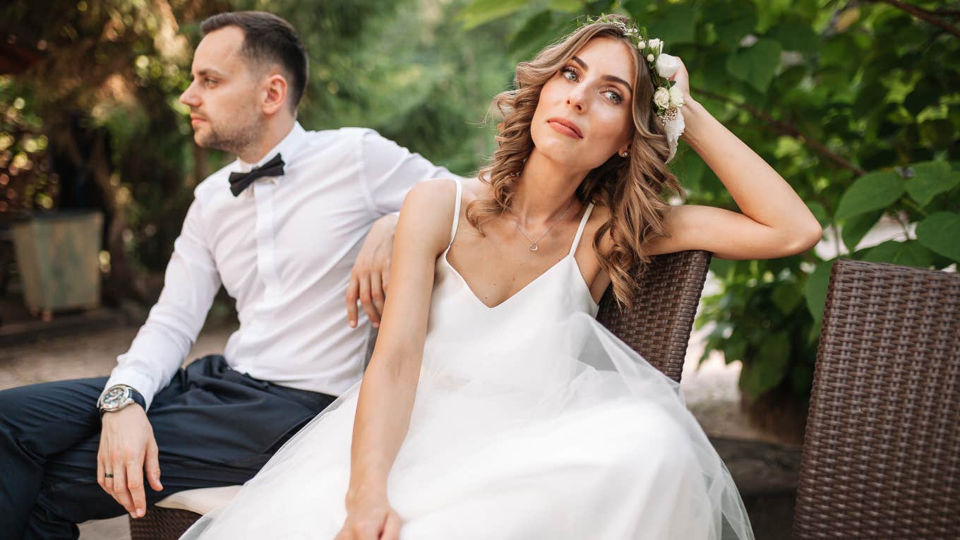 bride and groom looking away from each other