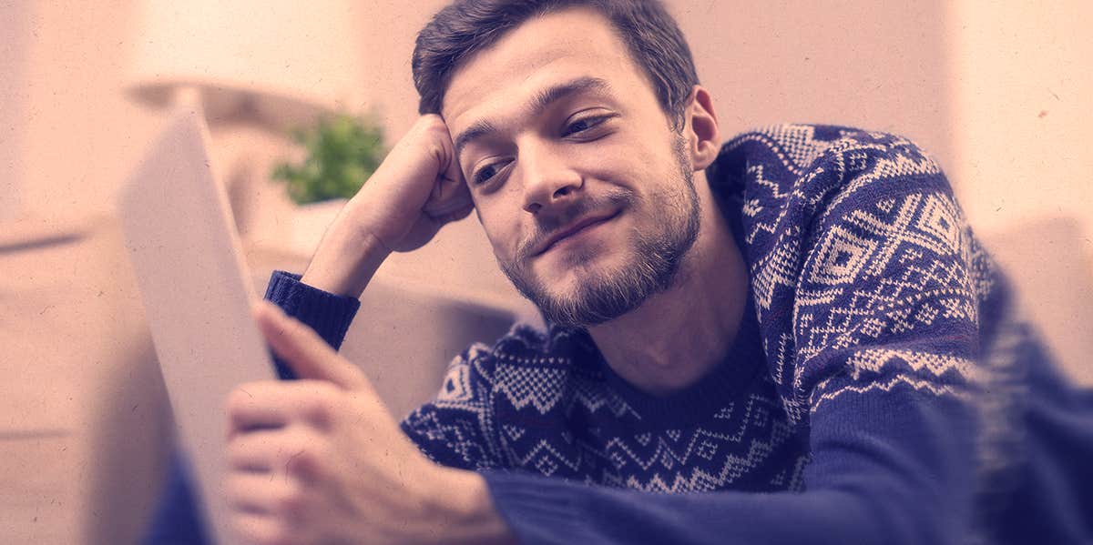 guy looking at a letter