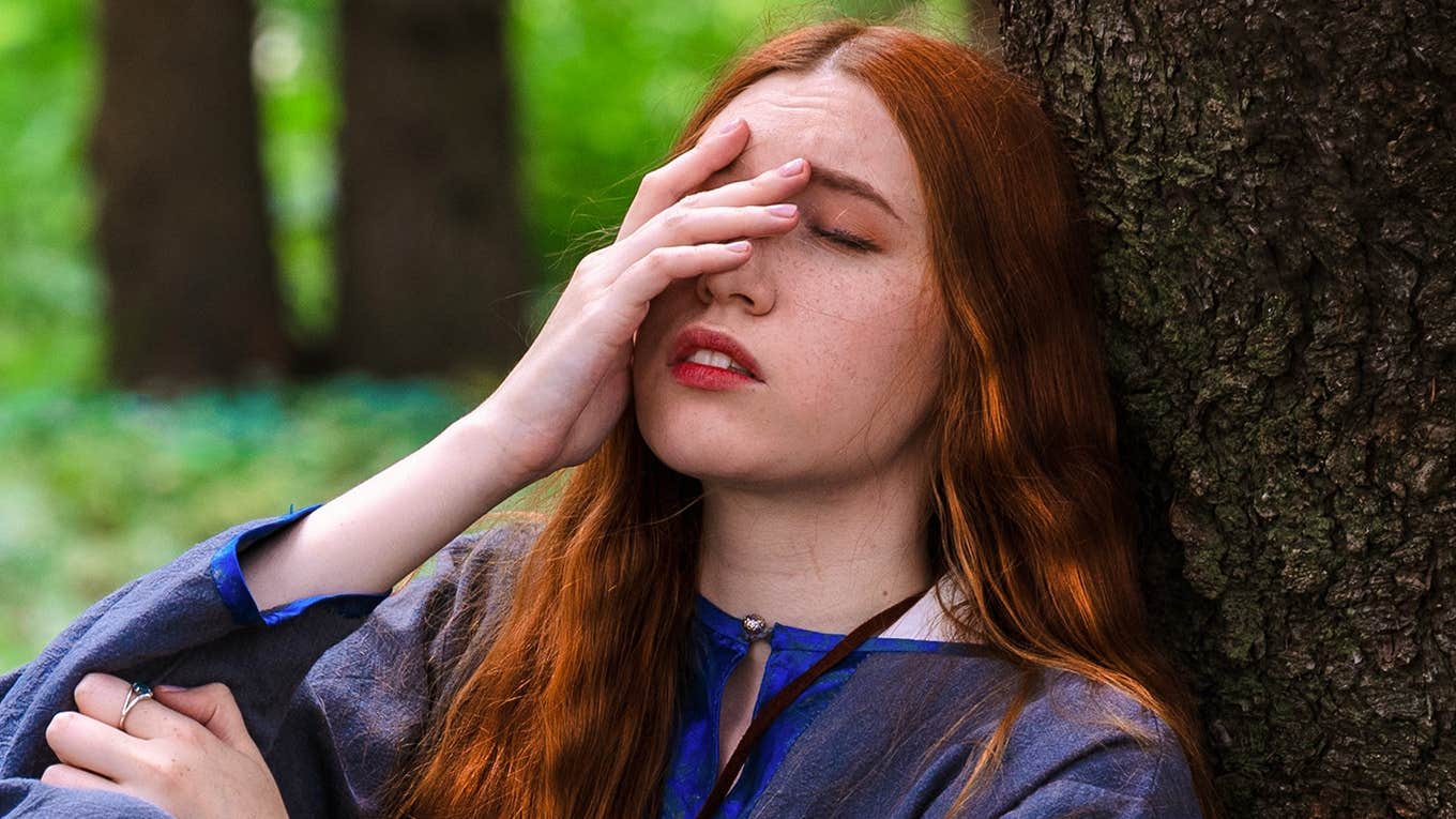 worried girl with hand over face