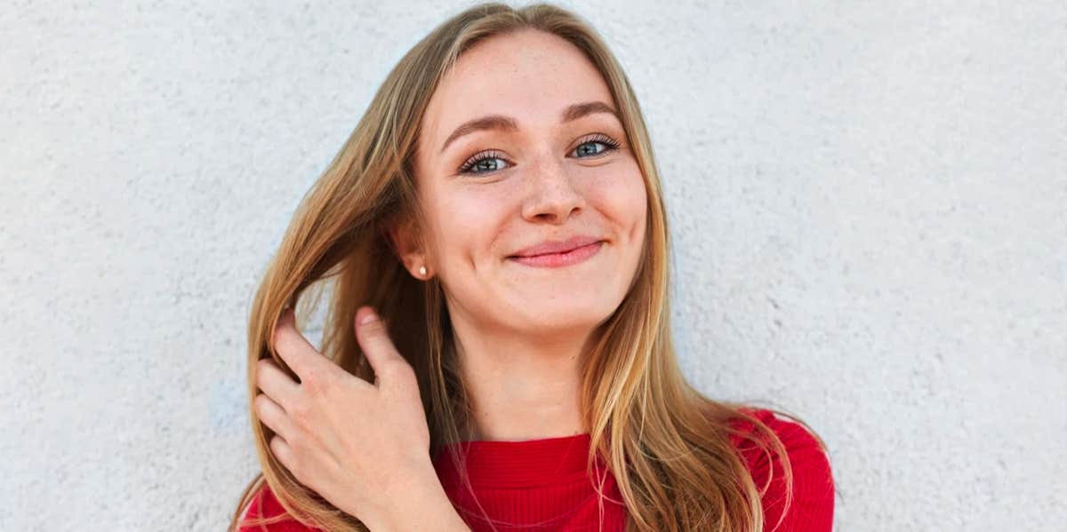 woman tossing hair to side