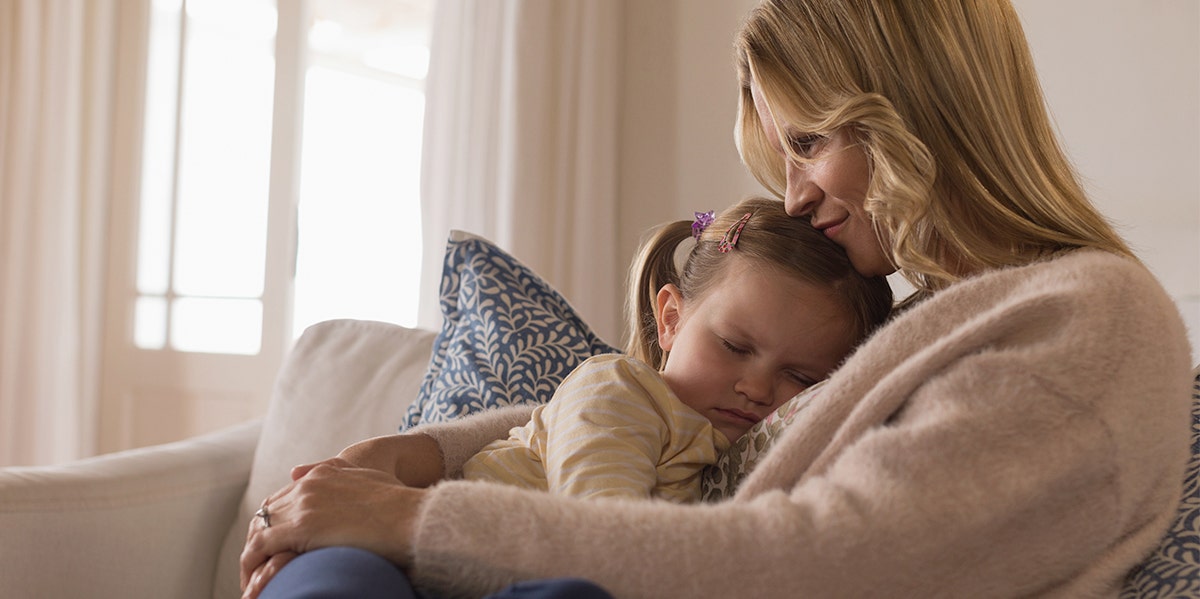 mother holding daughter