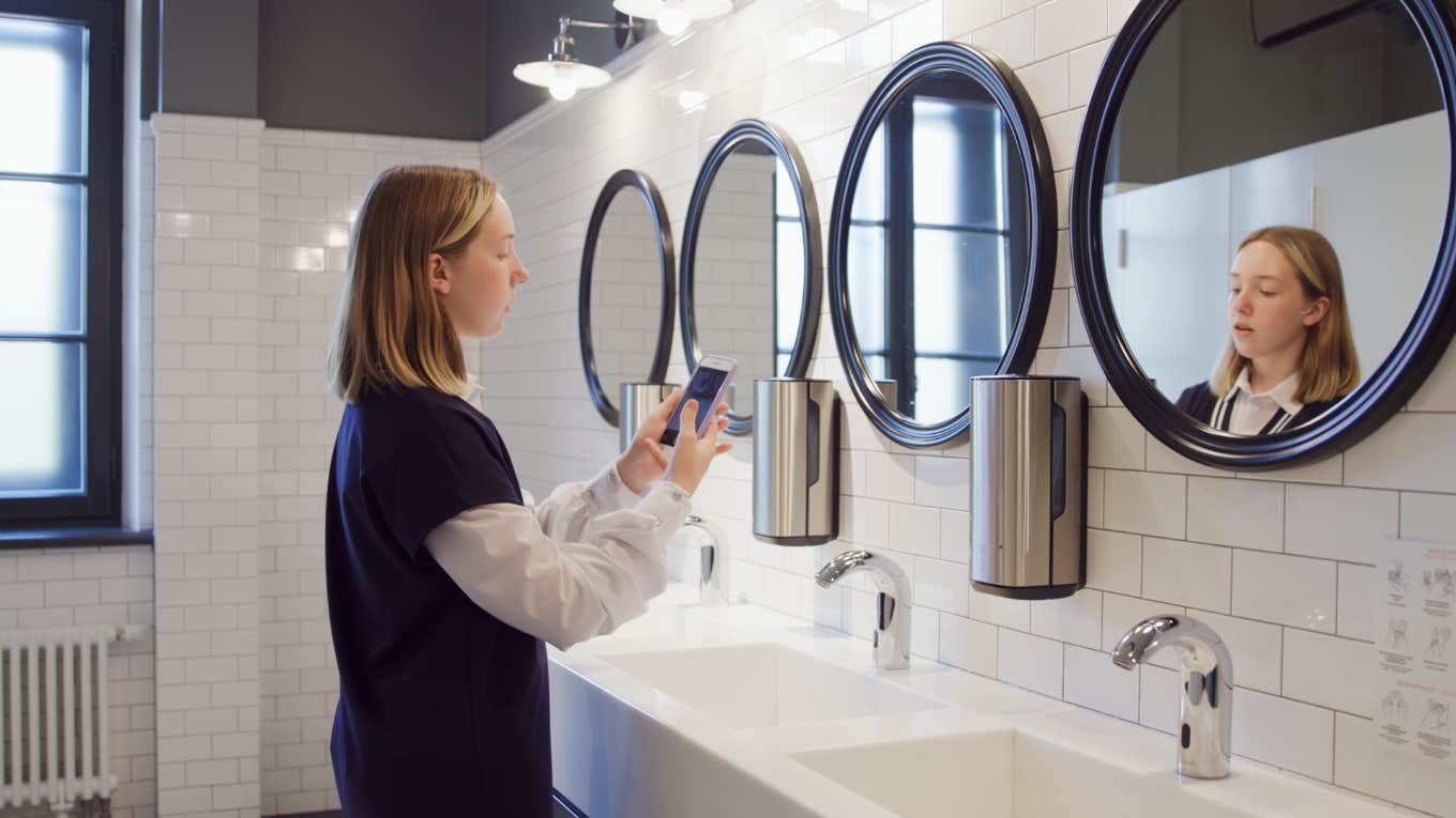 North Carolina Middle School Removes All Bathroom Mirrors To Stop Kids From Making TikTok Videos teenage girl, bathroom, taking selfies