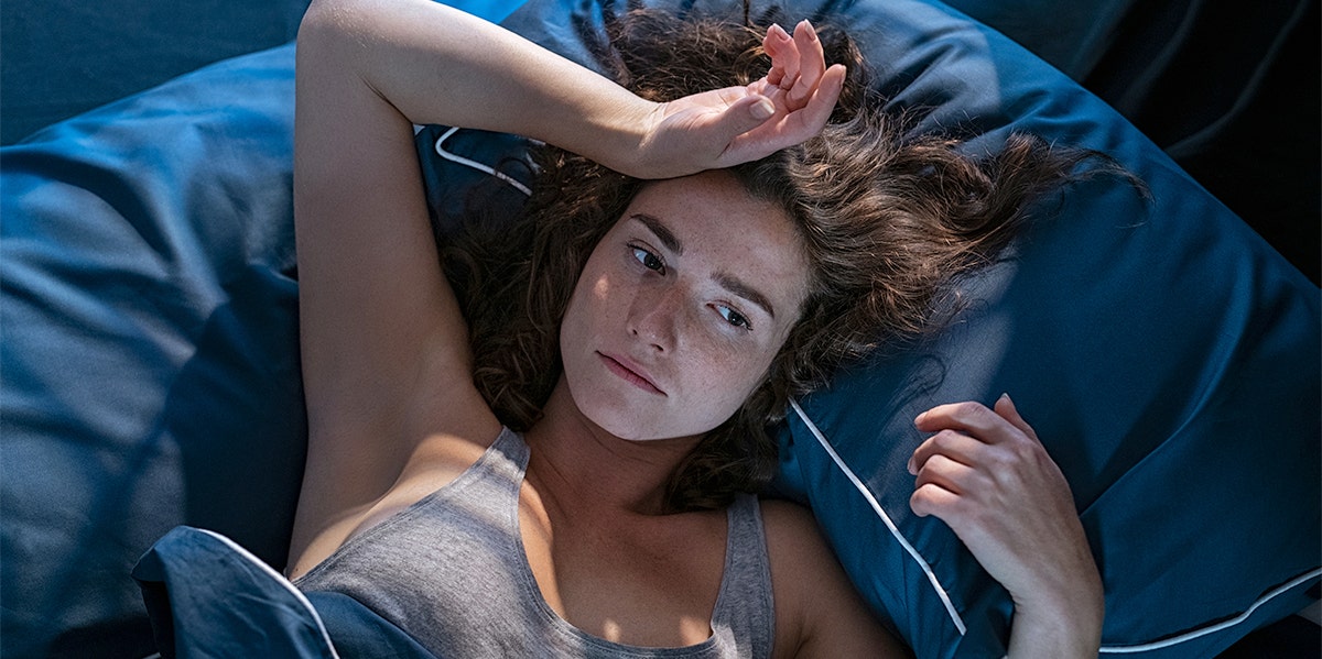 woman laying in bed