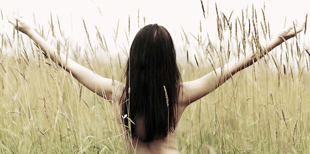 woman nude in field