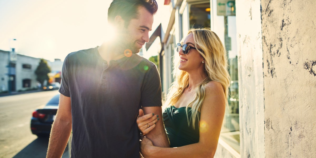 couple walking linking arms