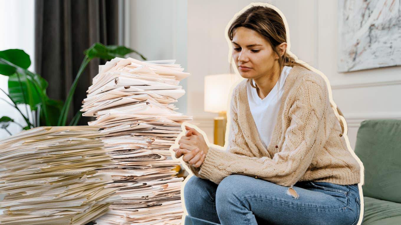 Woman sitting in front of documents