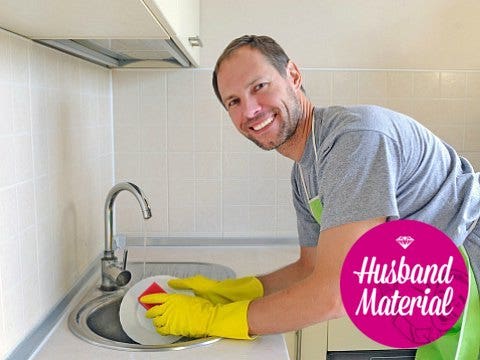 man washing dishes