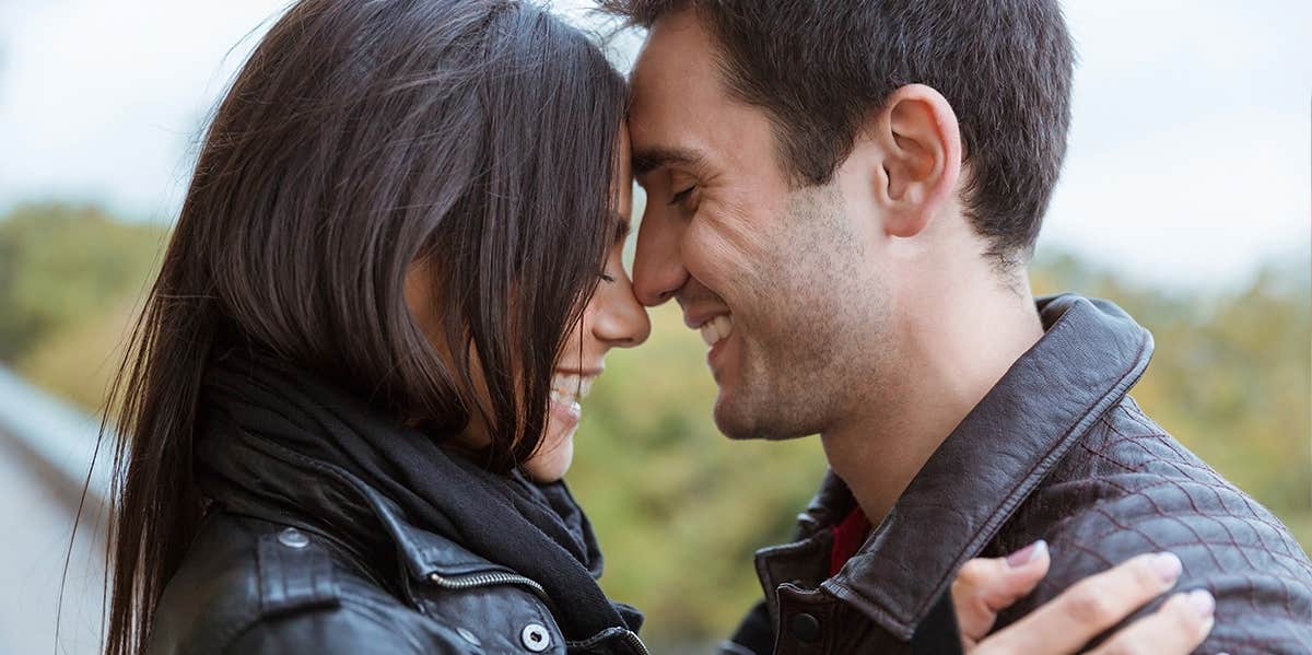 10 Old-School Ways To Say 'I Love You' That Men Really Appreciate woman and man embracing with foreheads touching
