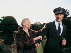 older woman touching arm of younger driver