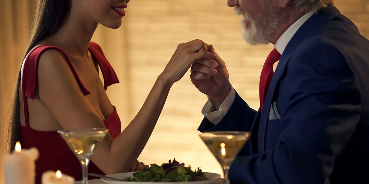 older man holding younger woman's hand Why Marrying A Man 25 Years Older Than Me Made Me A Better Person