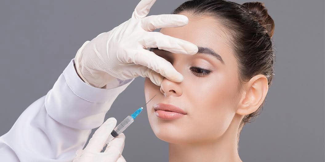 woman getting nose injections