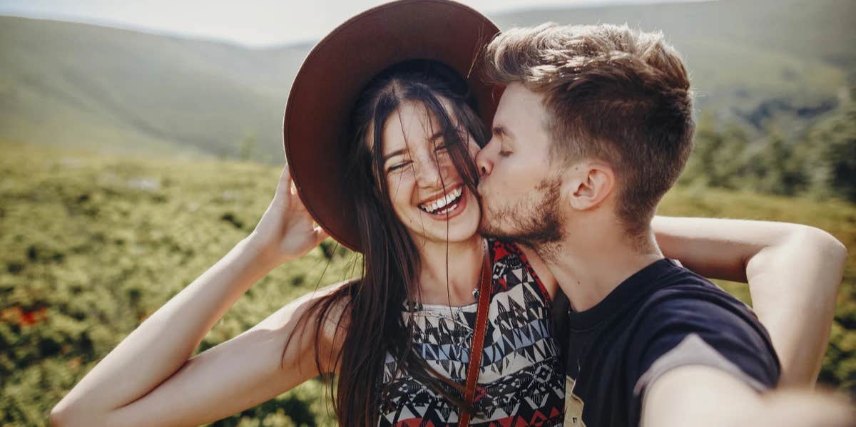 couple smiling kissing