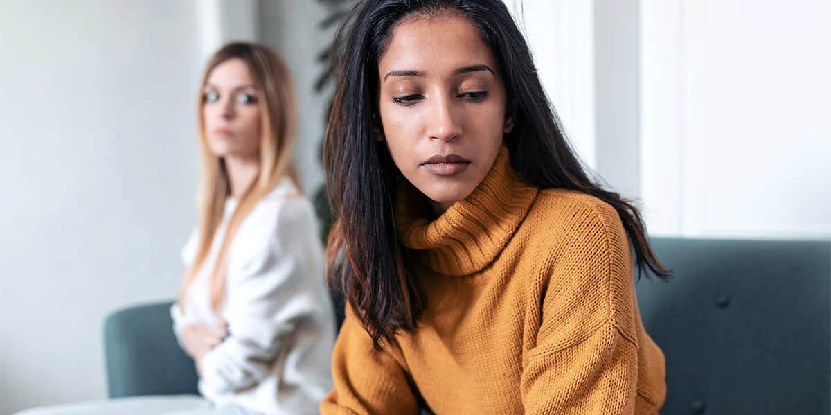Signs Of A One-Sided Friendship two unhappy friends sit in opposition
