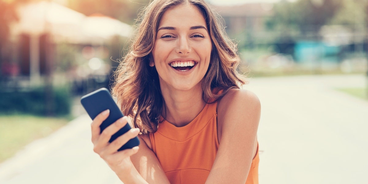 happy woman with her phone