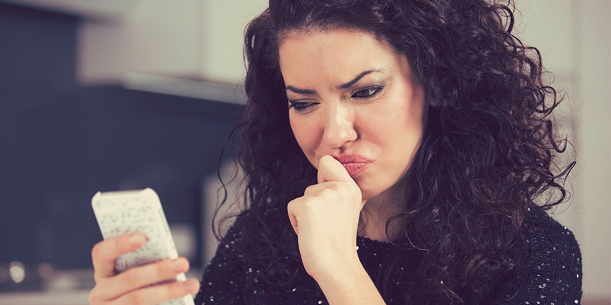 woman looking at her phone