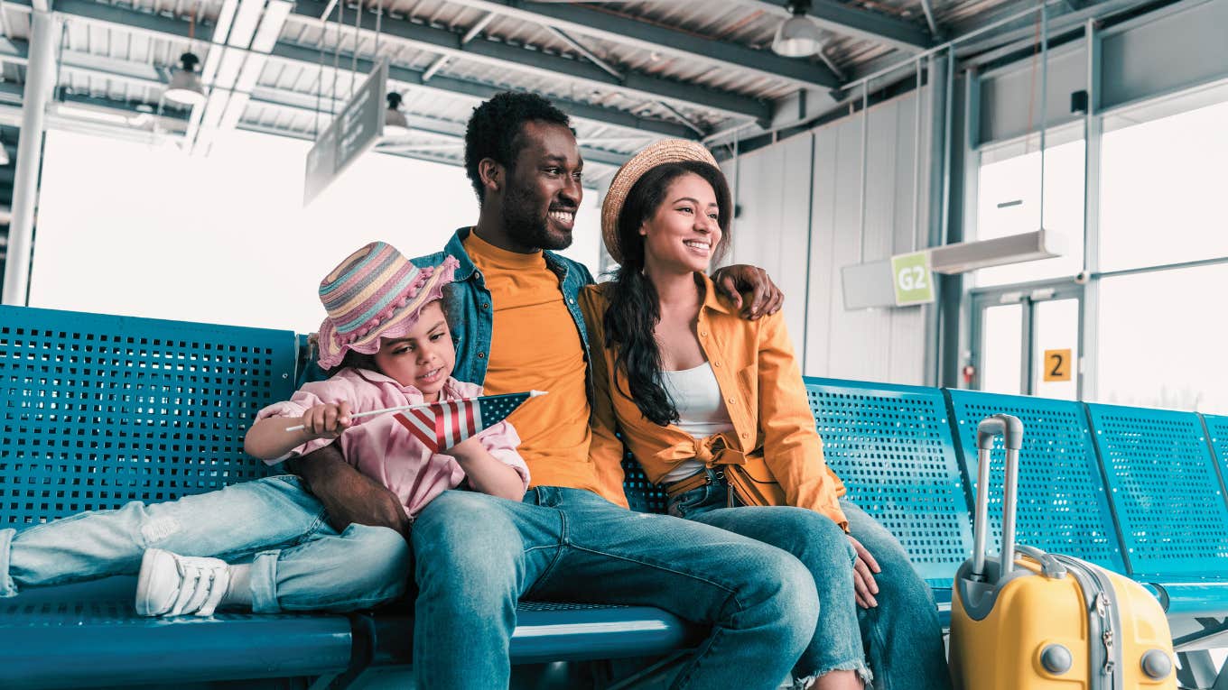 family sitting in airport