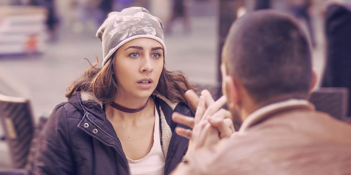woman looking shock when talking to a guy