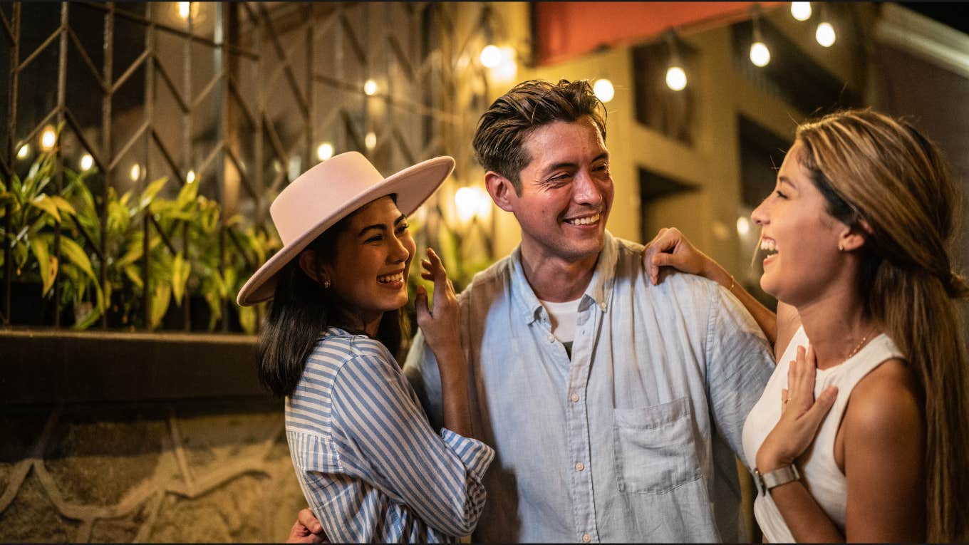 Man enjoying date with two woman 