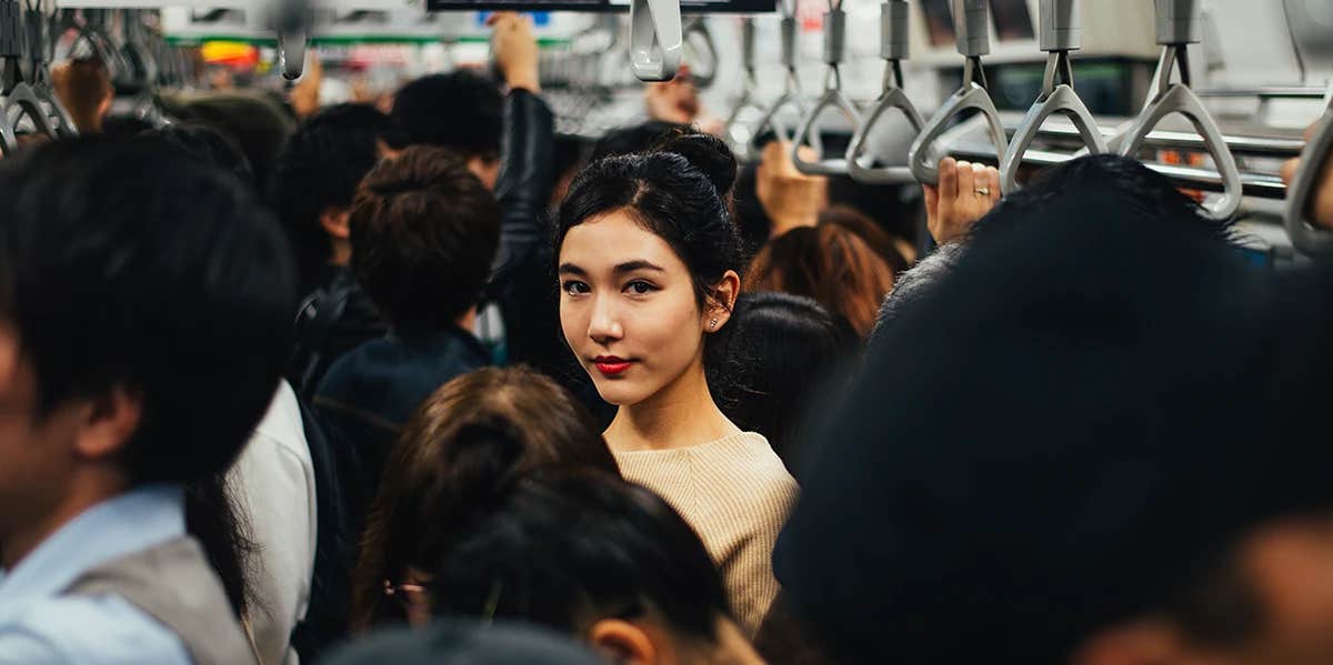 anxious woman on a crowded train