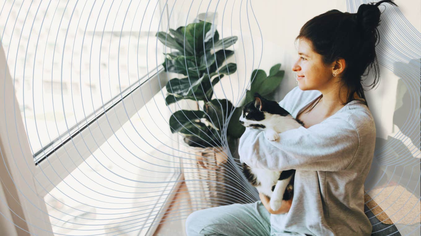 The Beneficial Side-Effect Of Being An Ultra-Sensitive Person Sensitive woman holding her cat looking out window