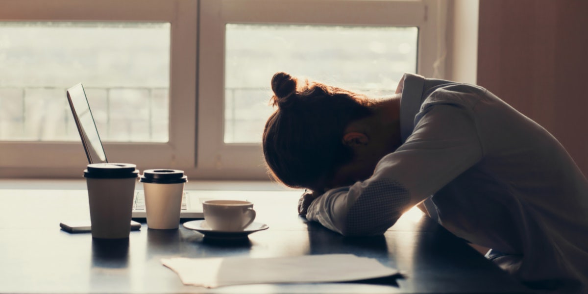 When You Can’t Escape The Overwhelming Sadness & Exhaustion woman with hands crossed and head bowed
