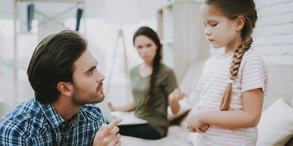 Parents scolding child