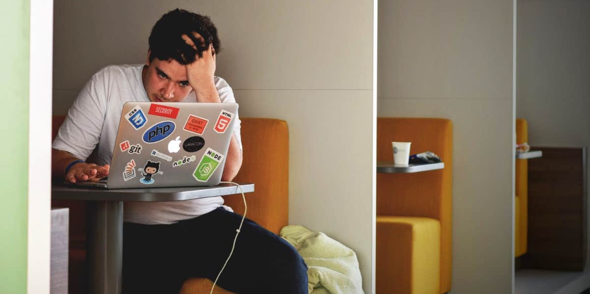 man sitting in front of computer