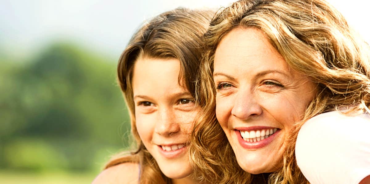 Mom and daughter smiling