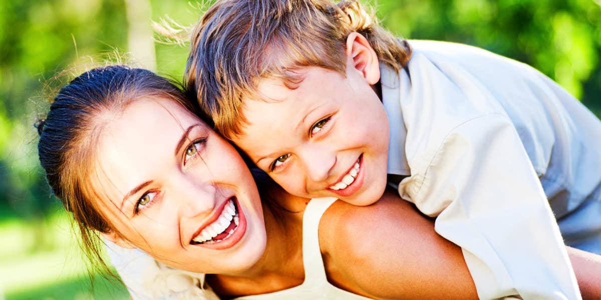 Laughing mother and child outdoors