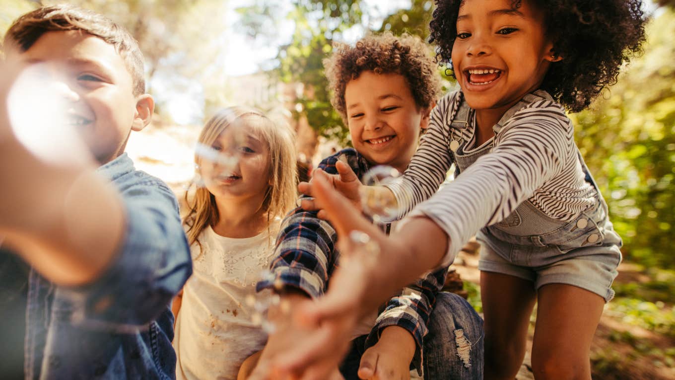 9 Genius Tips For Raising Generous, Loving Kids little kids playing with bubbles