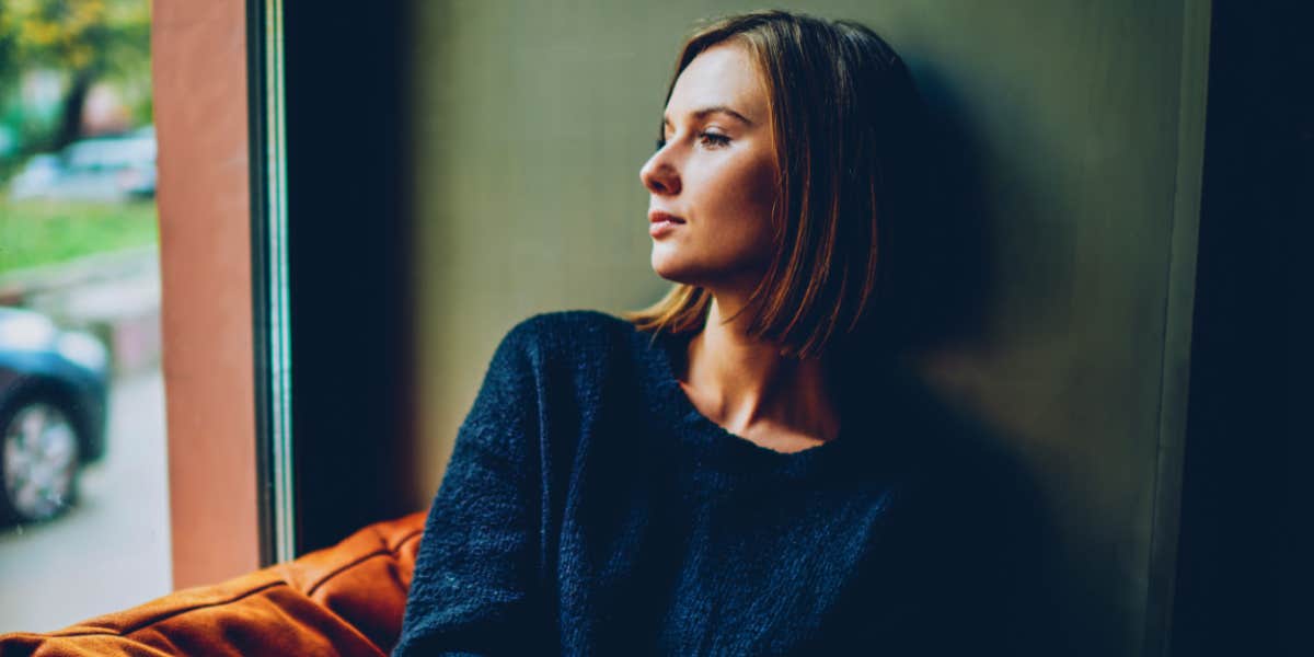 signs your parents don't love you woman looks out window