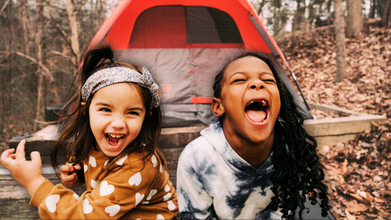 Siblings camping being silly