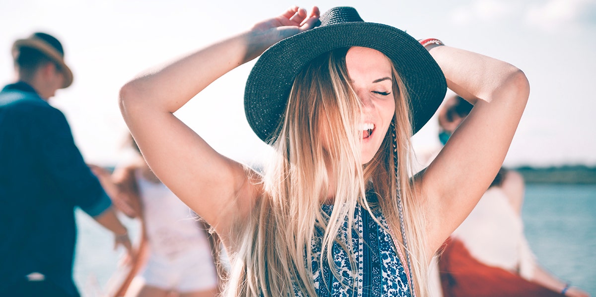 woman in hat having fun