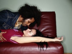passionate couple on red couch